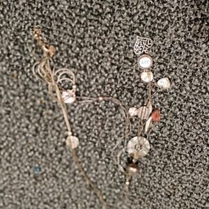 Necklace with heart and others charms on it